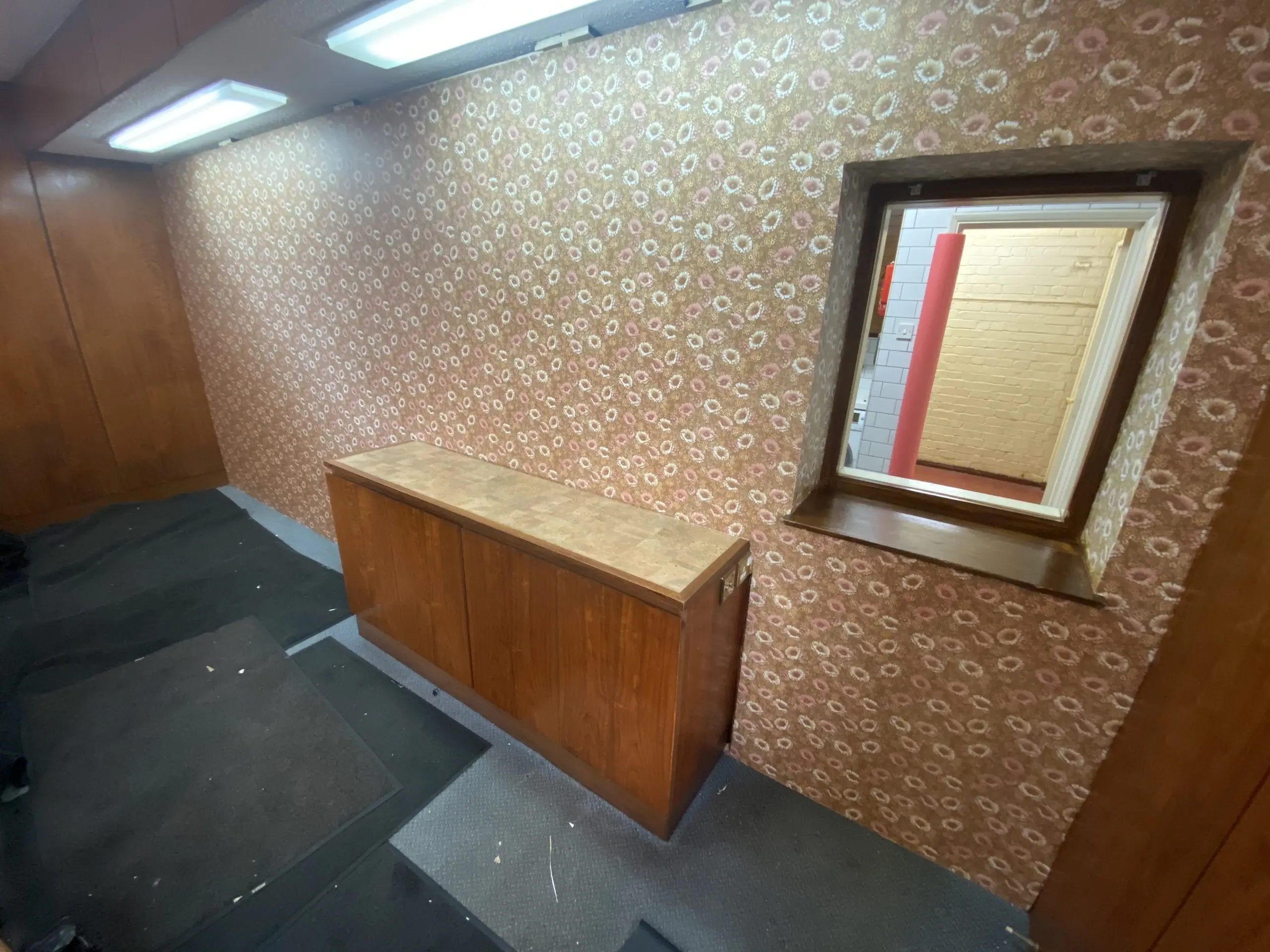 Film set decorating including wallpaper installation and repair