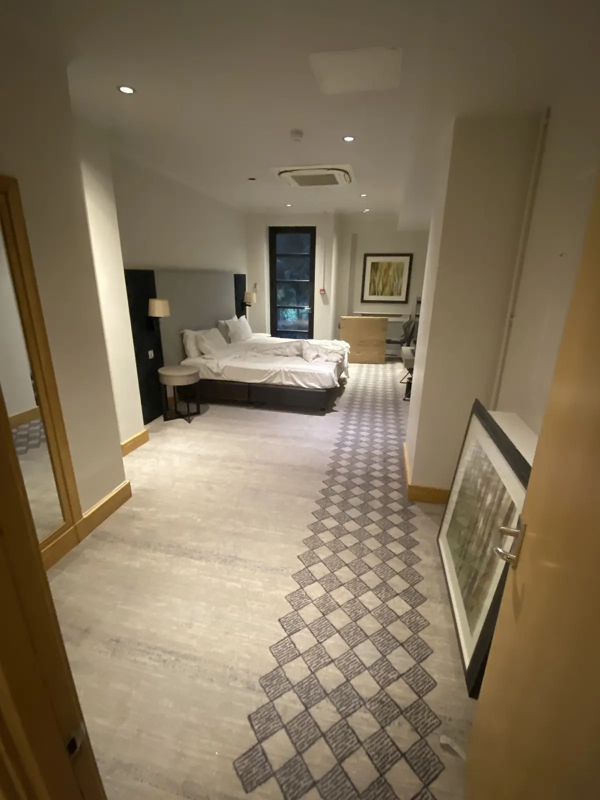Image of hotel suite bedroom at DoubleTree by Hilton Kensington London before painting and decorating